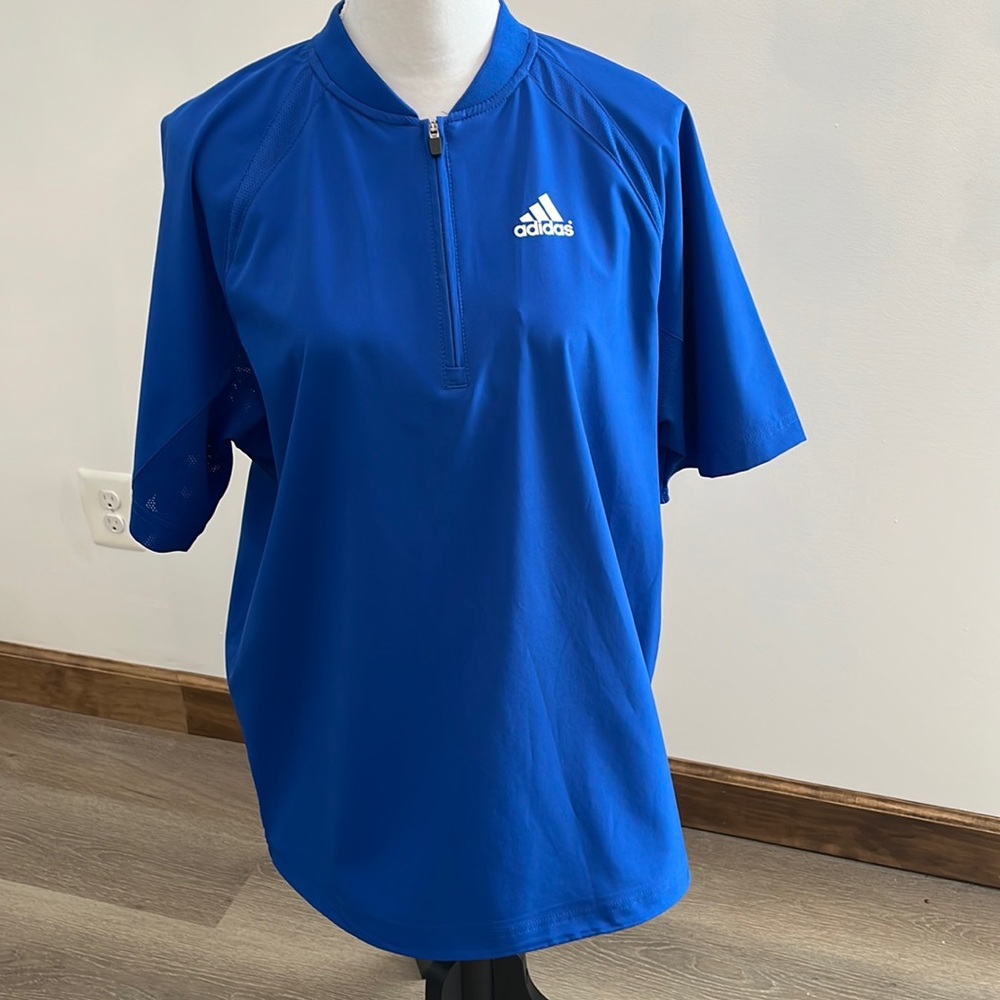 Adidas’s windbreaker. Measures 23 inches from armpit across.